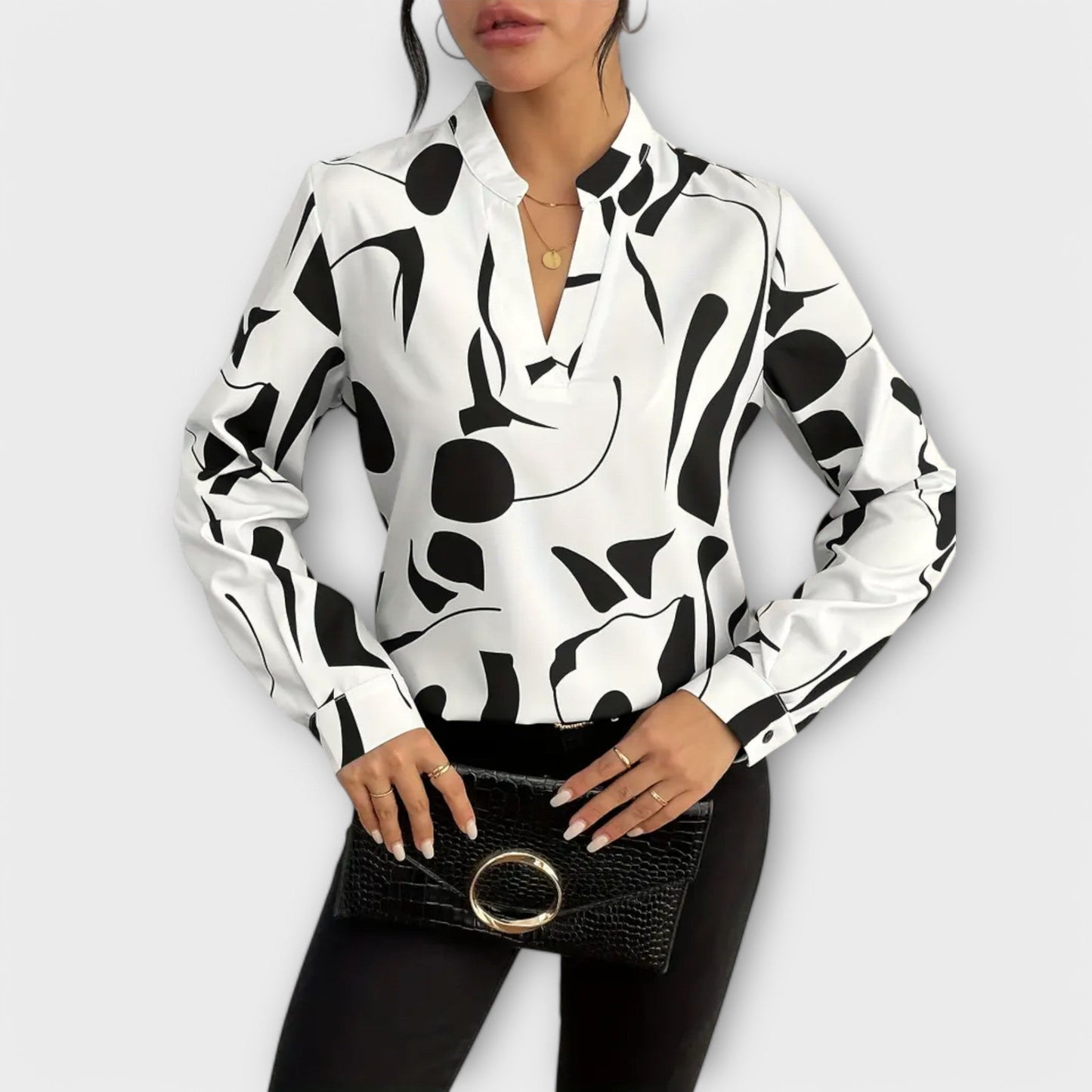 Elegante blouse met lange mouwen en V-hals in geometrisch patroon